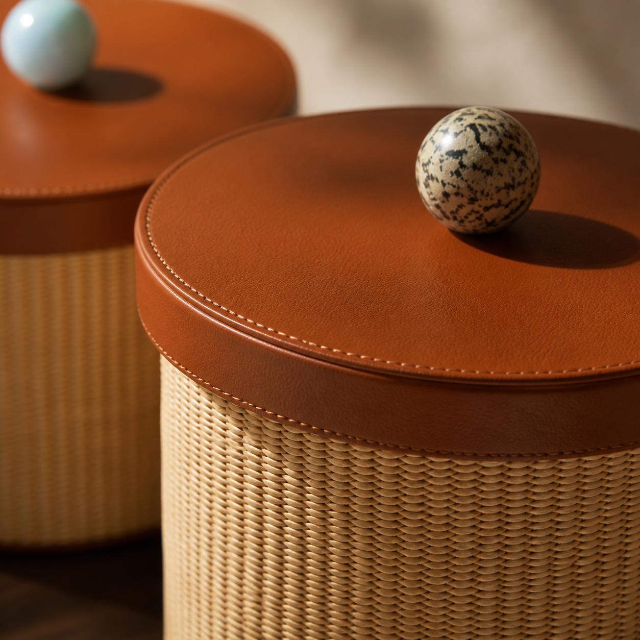 Detailed cognac stitched lid, stone pull and woven rattan texture