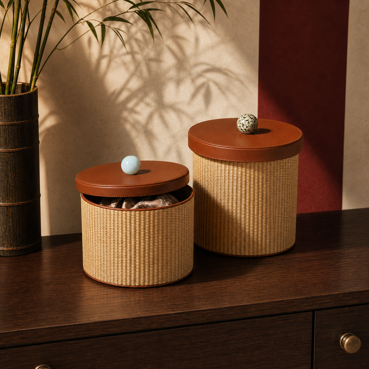 Rattan storage canisters styled on a dark wood console